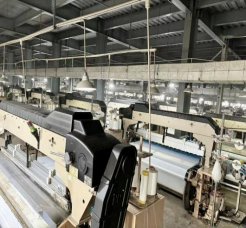 Water jet looms in operation